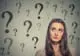 Woman with multiple question marks