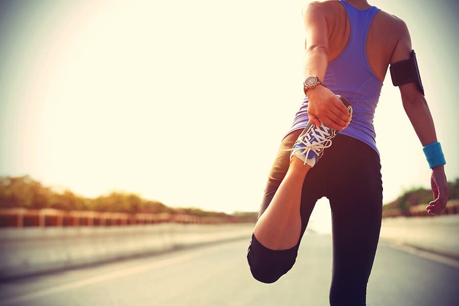 woman stretching before jogging