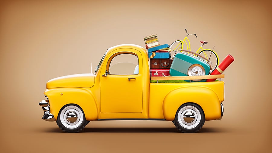 yellow pickup with items in trunk