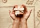 pivot business - person s holds brown gift box 842876